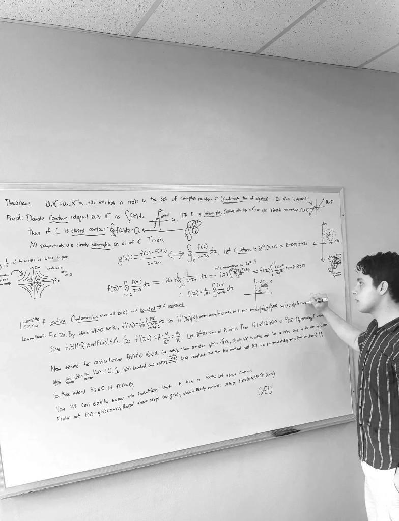 David Litman at a whiteboard proving the fundamental theorem of algebra using complex analysis